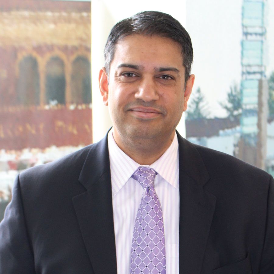 Person in suit smiling