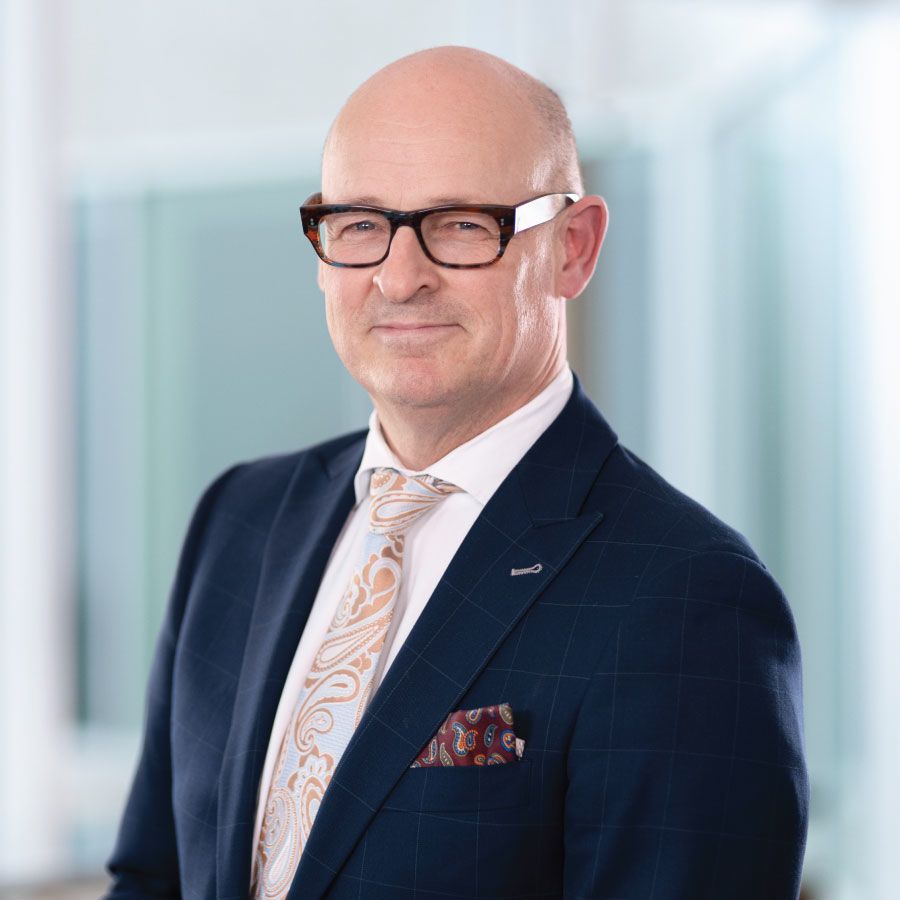 Person in suit smiling