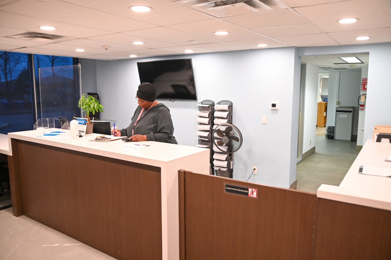 TCHC staff behind the service counter at a Tenant Service Hub.