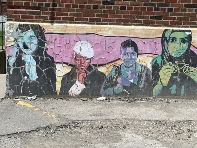 A mural depicting four people.