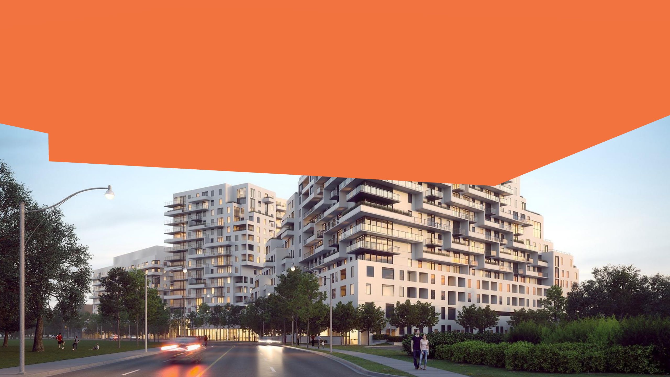 Two modern apartment buildings against a blue sky. 